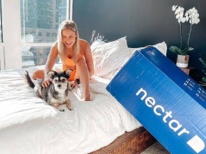 Girl with pet on bed